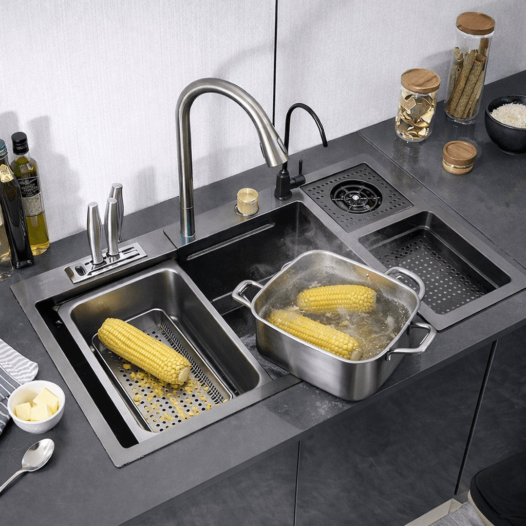Stainless steel kitchen sink with running water and corn on the cob, surrounded by kitchen items.