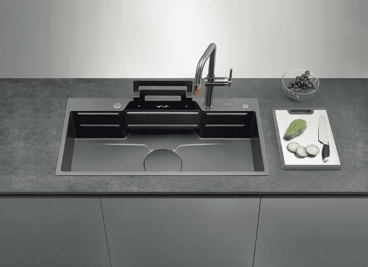 Modern kitchen sink with faucet on a gray countertop