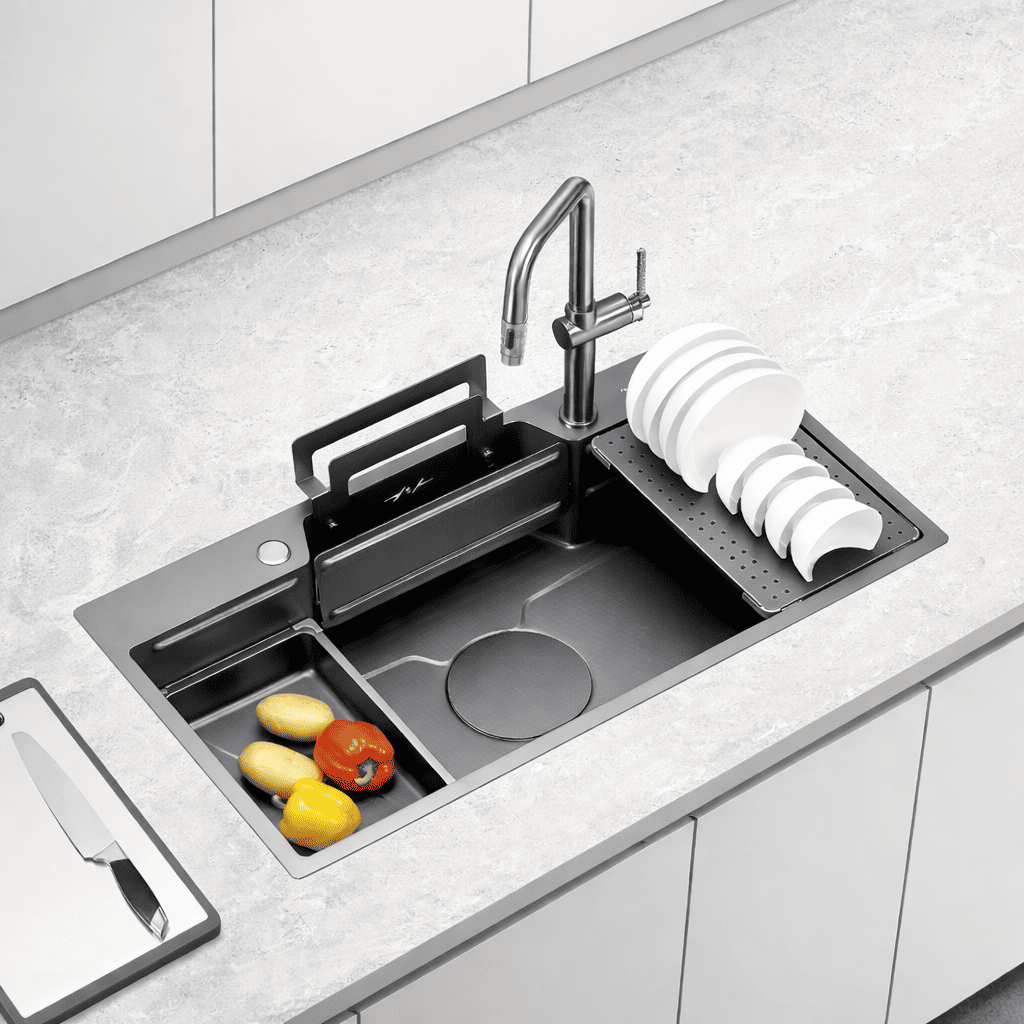 Modern kitchen sink with fruit and vegetables on a light gray countertop.