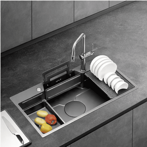 Modern kitchen sink with fruit and vegetables on a dark countertop